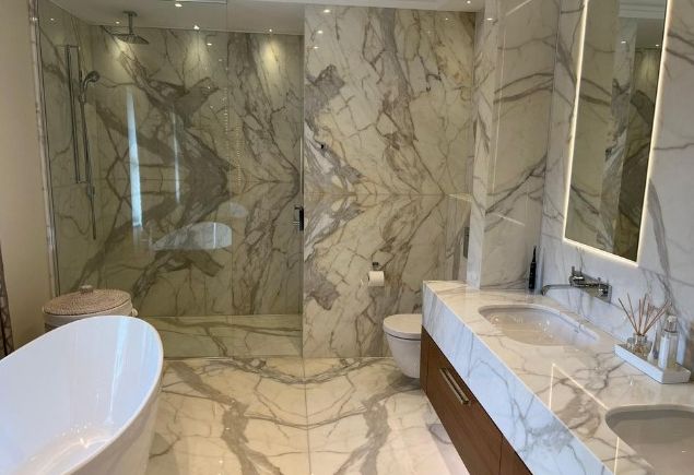 Marble bathroom with freestanding bath at Meadow Way