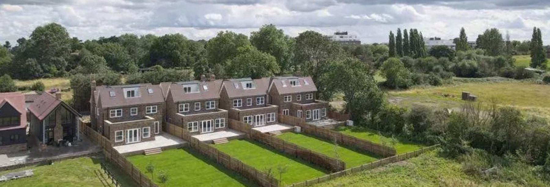 Orchid Grove homes beside open farmland